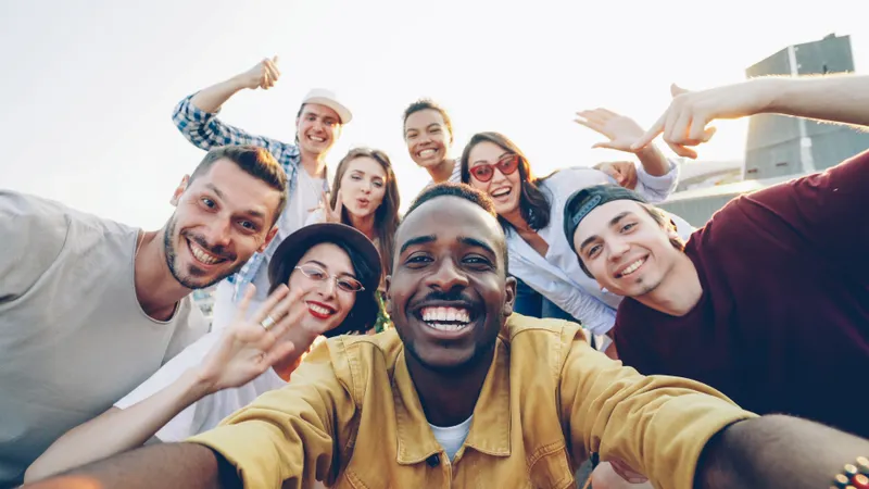 A group of friends smiling together outdoors